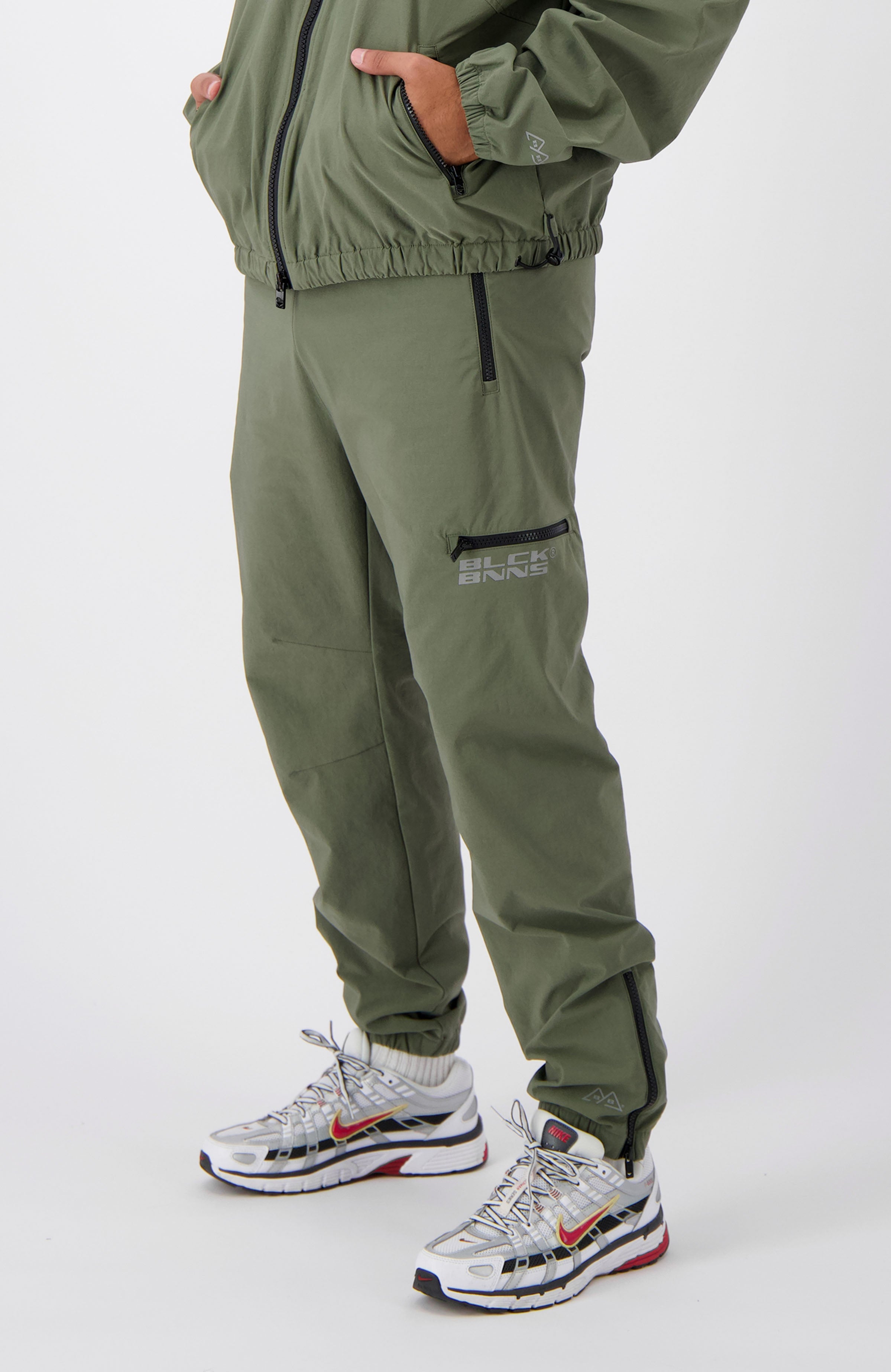 //blackbananas.com/cdn/shop/files/INITIAL_TRACKPANTS_1.224.4.04-8-bottom-09_{width}x.jpg?v=1726585082